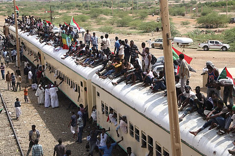 Sudanese pro-democracy supporters celebrate a final power-sharing agreement with the ruling military council. (Photo | AP)