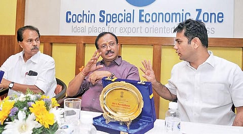 Union Minister of State(MoS) for External Affairs and Parliamentary Affairs V Muraleedharan sharing a light moment with Hibi Eden, MP, as  P T Thomas, MLA, looks on at the interaction with exporters at Cochin Special Economic Zone, Kochi, on Sunday | A Sa