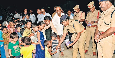 Jogulamba Gadwal District Superintendent of Police (SP) Rema Rajeswari interact with children during a campaign to create awareness on the spread of fake news | Express