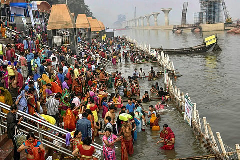 Devotees take a holy dip in the Ganga river during Nahay Khay Puja of the Chhath Puja festival in Patna. (File | PTI)