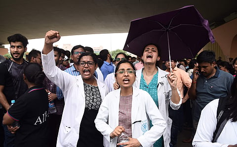 Doctors and medical students shout slogans during a protest against the National Medical Commission (NMC) Bill outside All India Medical Science in New Delhi on Thursday August 1 2019. | (Parveen Negi | EPS) 