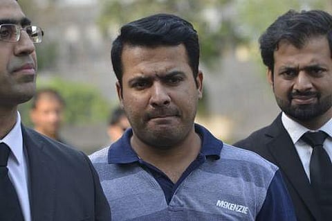 Pakistani cricketer Sharjeel Khan (centre) | AFP