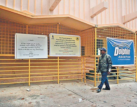 A BBMP notice put up at Kensington Swimming Pool informing the public that the pool will now be maintained by Dolphin Aquatics | Shriram BN