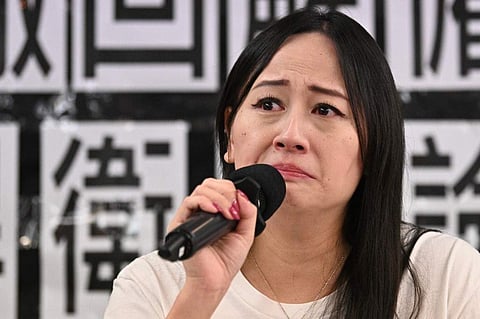 Rebecca Sy worked for the airline's regional arm Cathay Dragon and is also a union leader. (Photo | AFP)
