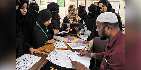Calligraphy artist Mohd Abdu Gaffar with his students at the Idara-e-Adabiyat-e-Urdu; (left) A close up of  his sheet (Photo | S Senbagapandiyan, EPS)