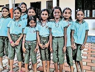 Children of  Govt LP School, Valayanchirangara, in their new uniform