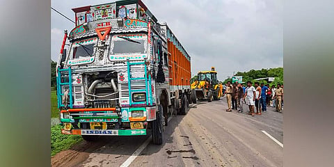 People stand near the site of accident in which the Unnao rape survivor was seroiusly injured after the car in which she was travelling collided with a truck, near Raebareli, Sunday, July 28, 2019.(Photo | PTI)