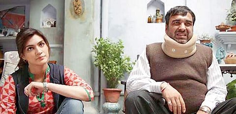 Actors Kriti Sanon and Pankaj Tripathi in a still from Bareilly Ki Barfi.