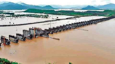 Godavari floodwater flowing over the spillway of Polavaram project in West Godavari district on Friday | Express