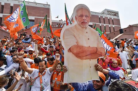BJP supporters carry a cut-out of PM Narendra Modi. (File Photo | PTI)