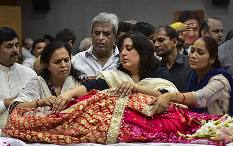 Bansuri Swaraj, daughter, and Swaraj Kaushal, husband of former external affairs minister Sushma Swaraj at BJP headquarters in New Delhi on 7 August 2019. (Photo | PTI)