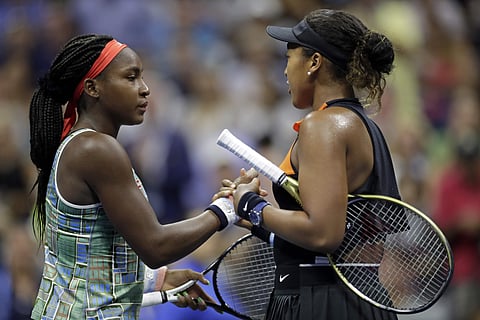 Coco Gauff, left, of the United States, shakes hands with Naomi Osaka, of Japan, after Osaka defeated Gauff during the third round of the U.S. Open tennis tournament. (Photo | AP)