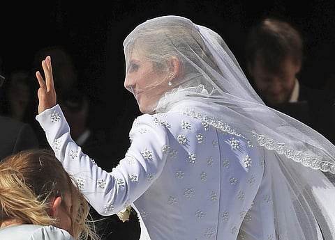 Goulding's wedding gown was made of silk double crepe and hand-embroidered with White Roses of York and embellished with white glass beads. | ( Photo | AP )