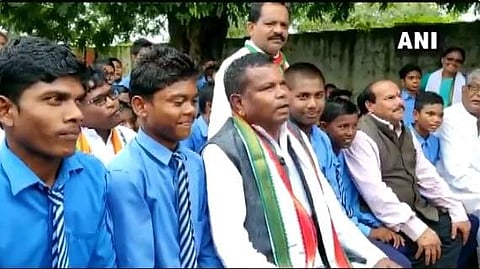 Chhattisgarh Minister Kawasi Lakhma with students at a Teachers Day event in the state. (Photo | ANI/Twitter))