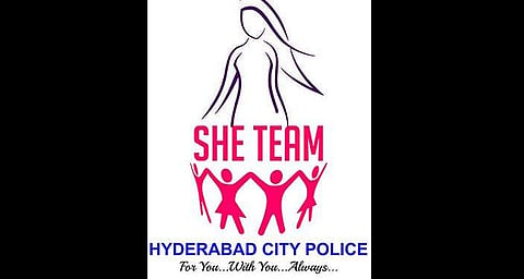 SHE team police logo