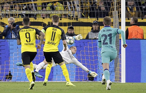 Barcelona's goalkeeper Marc-Andre ter Stegen saves a shot by Dortmund's Marco Reus during the Champions League. (Photo | AP)