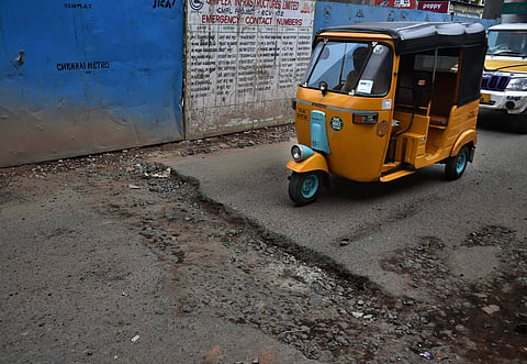 Potholes and metro-rail debris irk commuters plying on Thiruvottriyur High Road inn Chennai - Express / P Jawahar