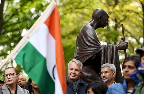 Visiting India's Minister of External Affairs Subrahmanyam Jaishankar, right, and Finnish Foreign Minister Pekka Haavisto unveil a statue of Mahatma Gandhi in Helsinki, Finland. (Photo | AP)