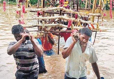 Karuppayi’s funeral procession passing through the stream, in Anaicut Taluk on Friday | Express