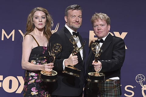 Annabel Jones, from left, Charlie Brooker and Russell McLean of 'Black Mirror: Bandersnatch' pose in the press room. The interactive, genre-bending Netflix film won an Emmy for Outstanding Television Movie. It’s the second Emmy for 'Bandersnatch', followi