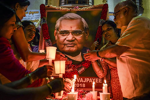 BJP members hold candles to pay tribute to former prime minister Atal Bihari Vajpayee. (File | PTI)