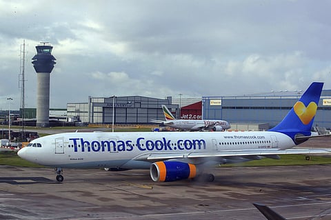A Thomas Cook plane taxis on the runway at terminal one of Manchester Airport, England. (Photo | AP)