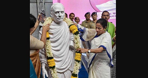 Chief Minister Mamata Banerjee garlanding a statue of Vidyasagar. (Photo| PTI)