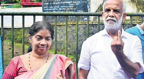 UDF candidate Jose Tom and wife Jessy Tom after casting their votes at the booth set up at the Govt LP School, Poovathode on Monday  | Express