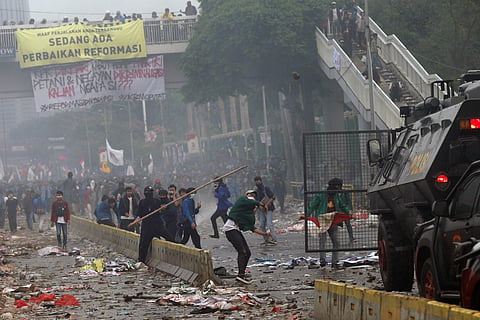 Student protesters use sticks to attack riot police during clash. ( Photo | AP )