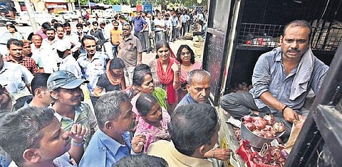 People queue up to purchase onions at subsidised rate.| (  Photo | Parveen Negi )