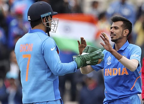 MS Dhoni (L) and Yuzvendra Chahal. (Photo | AP)