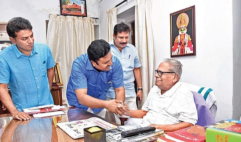 LDF candidate for Aroor assembly constituency Manu C Pulickal seeking the blessings of Administrative Reforms Commission chairman V S Achuthanandan at the latter’s residence in Thiruvananthapuram on Sunday. A M Ariff, MP, and Achuthanandan’s son V A Arun 