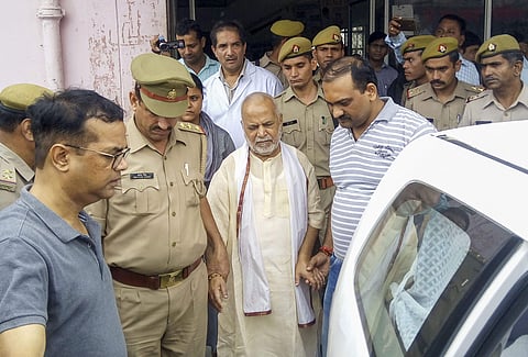 Former Union minister Swami Chinmayanand accused of rape by a law student is seen outside a government hospital after a medical examination following his arrest in Shahjahanpur. (Photo | PTI)