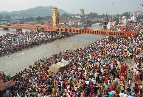 People gather on the banks of river Ganga to pay obeisance in Haridwar. (File | PTI)