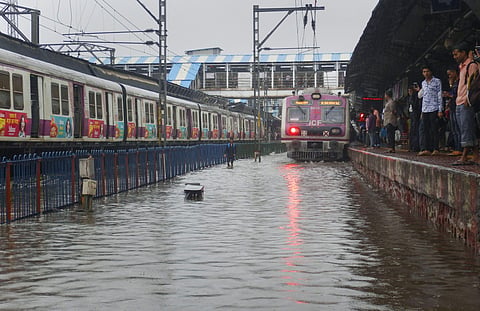 A view of waterlogged railway tracks following heavy rains in Thane. (Photo | PTI)