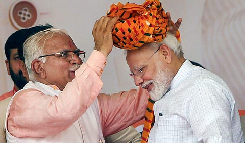 Prime Minister Narendra Modi is presented a turban by Haryana Chief Minister Manohar Lal Khattar during a public rally in Rohtak on September 8, 2019. (Photo | PTI)