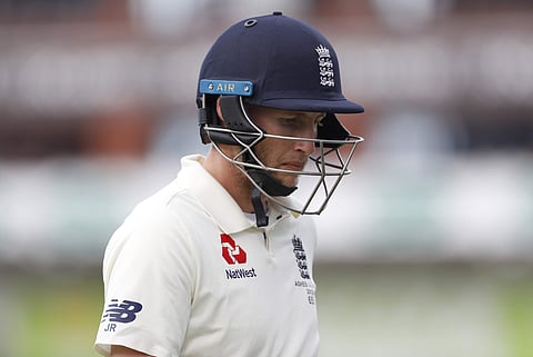 England captain Joe Root leaves the field after being dismissed during day three of the fourth Ashes Test cricket match between England and Australia at Old Trafford in Manchester, England, Friday, Sept. 6, 2019. | AP