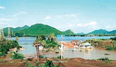 Godavari floodwater flowing over Kadamma bridge in Polavaram mandal cutting off road connectivity to several villages on Sunday. (Photo | EPS)q