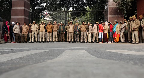 Police personnel guard at the main gate of the violence-hit Jawaharlal Nehru University (JNU), in New Delhi on Monday, January 6, 2020. (Photo | Shekhar Yadav, EPS)