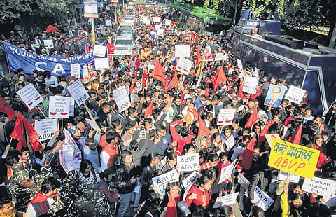 Memebers of Akhil Bharatiya Vidyarthi Parishad (ABVP) participate in a rally in support of CAA and NRC, at Delhi University. (Photo | PTI)