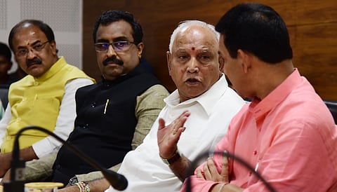 BJP National General Secretary  Ram Madhav, CM B S Yediyurappa and BJP state president Nalin Kumar Kateel at the meeting. (Photo | Vinod Kumar T, EPS)