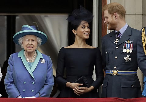 Britain's Queen Elizabeth II, Meghan and Prince Harry. (Photo | AP)