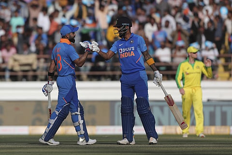 Virat Kohli and KL Rahul greet each other during the second ODI against Australia in Rajkot. (Photo | AP)