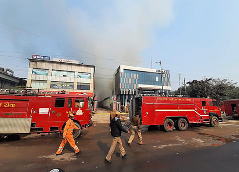 Firefighters trying to control fire at Peera Garhi in New Delhi on Thursday. (Photo | Shekhar Yadav, EPS)