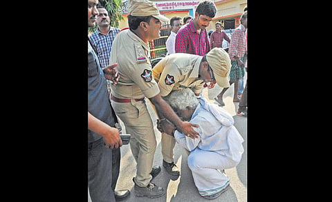 A Mandadam man pleads with police to be allowed to meet local MLA. (Photo | Prasant Madugula, EPS)