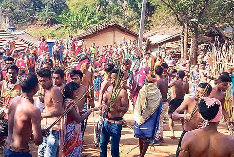 Tribal youths take part in Jhatimara ritual in Bonda Hill on Saturday | Express