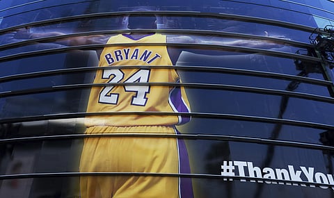 A giant banner congratulating Kobe Bryant is draped around Staples Center before his last NBA basketball game in downtown Los Angeles.  (Photo | AP)