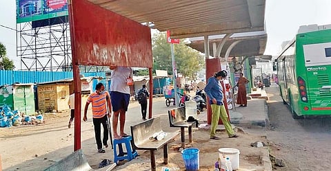 IT professionals and their families spot fix and clean a bus stop at Miyapur crossroads as part of Republic day celebrations on Sunday.