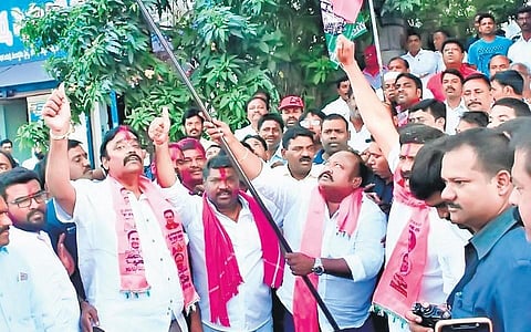 BC Welfare Minister and Karimnagar MLA Gangula Kamalakar hoists the TRS flag after the party’s victory in the MCK polls, on Monday. (Photo| EPS)