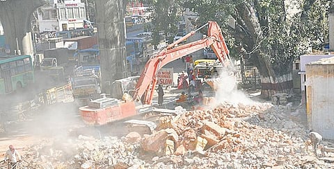 The Anjaneya temple being pulled down at Garvebhavipalya on Monday I NAGARAJA GADEKAL